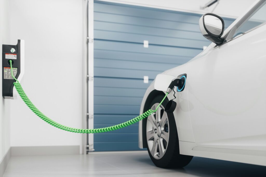 Electric vehicle charging with a green cable in a home garage